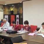 Participants taking notes at the May 2025 alumni meeting