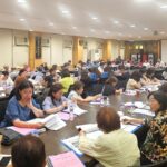 Participants taking notes at the May 2025 alumni meeting