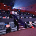 Attendees enjoying snacks and chatting before the screening starts