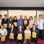 New officers holding certificates during the induction ceremony group photo