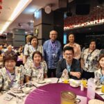 Alumni and family members enjoying a relaxed table setting