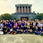 Large CKSCAA52 group photo at historic Vietnam landmark