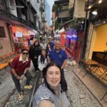 CKSCAA52 members exploring a narrow street in Vietnam