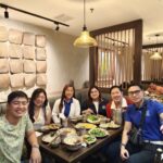 Alumni sharing dinner at local Vietnam restaurant